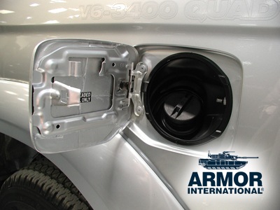 Armored gas tank door